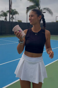 Social media influencer holding smoothie